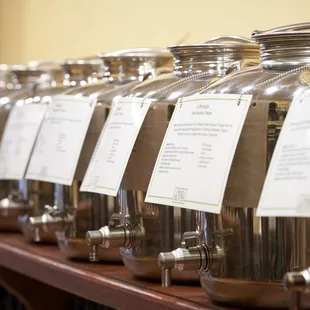a row of jars with labels on them
