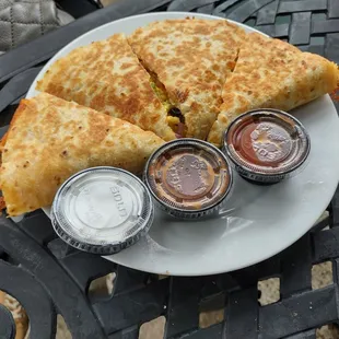 Quesadilla with mushrooms, onions, green peppers, and hashbrown, two salsas, and sour cream. $8.95