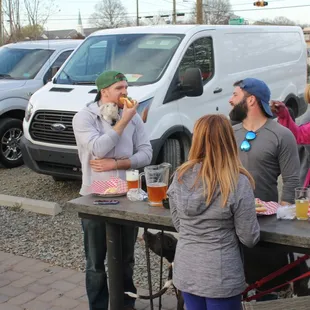 Notice the puppy under his shirt.