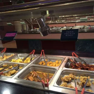 a variety of food items in a buffet