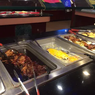 a variety of food items in a buffet