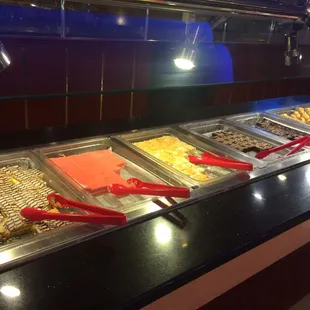 a variety of food items in a buffet