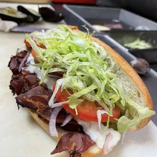 a sub sandwich on a cutting board