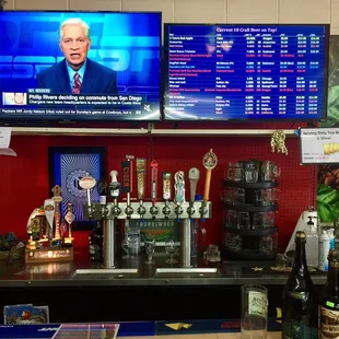 a bar with a television and a television screen