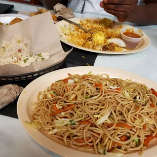a plate of noodles and vegetables