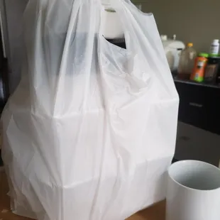 a plastic bag and a coffee cup
