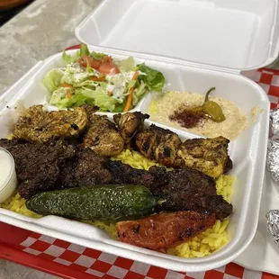 Beef &amp; Chicken plate. Served with hummus, rice, and salad.