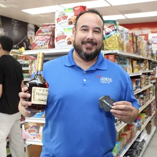 a man holding a bottle of liquor