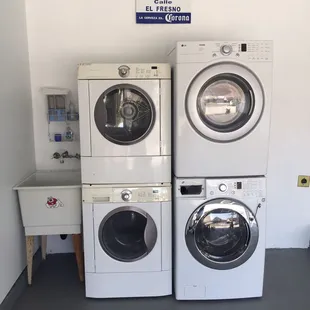 Finished laundry section of the garage. Previously the washer and dryer were on separate walls in the garage. (Weird 1976 set up)