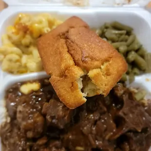 Oxtails/rice, green beans, mac n cheese, and corn bread