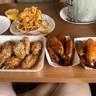 Extra Hot mixed with Garlic Parmesan, Spicy BBQ, and Thai with a side of curly fries and cheese sauce. So freaking good!