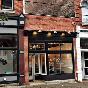 a brick building with a storefront