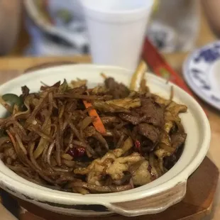 a bowl of stir fried noodles