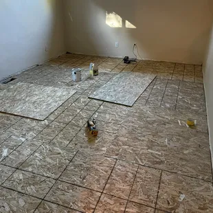 Final new OSB sub floor and new carpet and pad goes on top