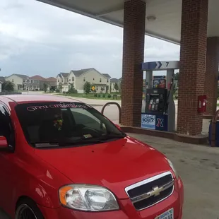 a red chevrolet aveo