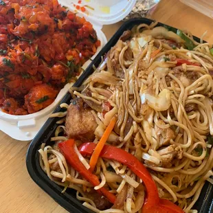 a plate of noodles with meat and vegetables