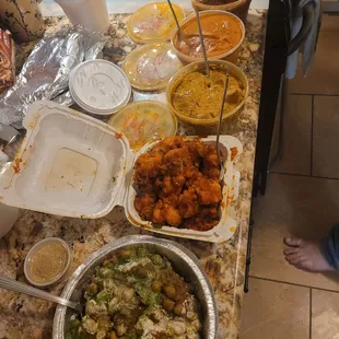 A feast! Samosa chaat, Gobi 65 (cauliflower), chicken korma, butter chicken, lamb vindaloo, and some naan and rice. 1.29.23