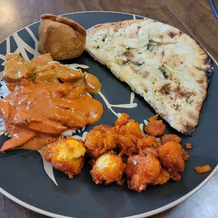 L to R: samosa, Gobi 65, chicken Tikka masala, butter chicken