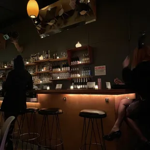 a woman sitting at a bar
