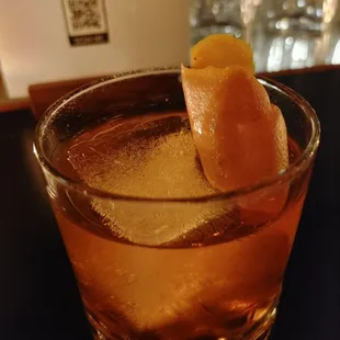 a drink in a glass on a table