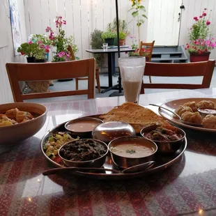 Jhol momo, Thali, and steamed momo. Peep the adorable patio!