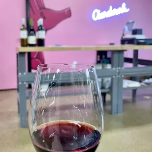 a hand holding a wine glass