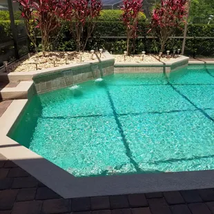 Note garden area behind waterfalls where dirt was dug to access the leak.