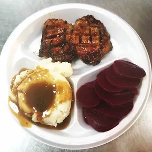 BBQ pork chops , homemade mashed potatoes and gravy and pickled beets