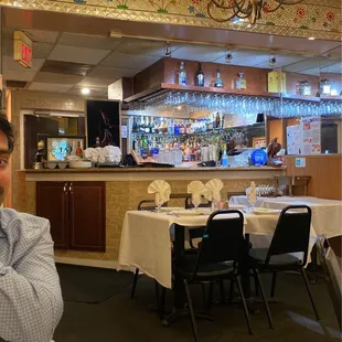 a man sitting at a table in a restaurant