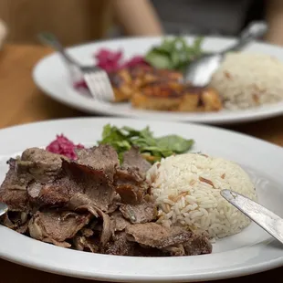 a plate of meat and rice