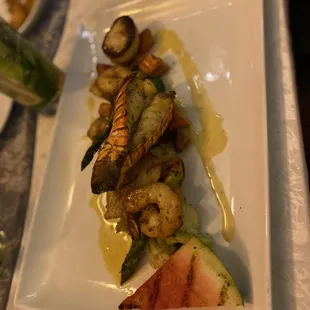 Mixed Grille - Grilled local fish, lobster tail &amp; scallop with a shrimp, Roast potato, garden vegetable, grilled watermelon