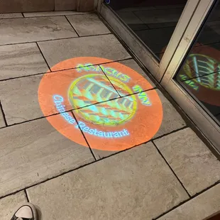 a logo projected on the floor