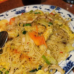 a plate of noodles and vegetables