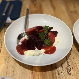 two plates of food on a wooden table