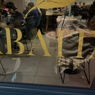 the reflection of people in the window