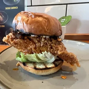 Chicken sandwich ($13) with fried chicken breast and chili crunch.