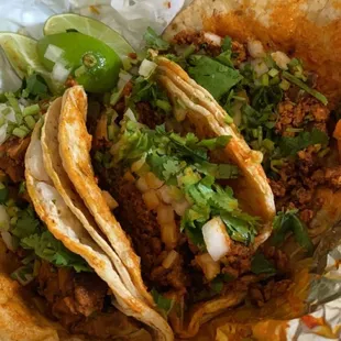 two tacos on tin foil