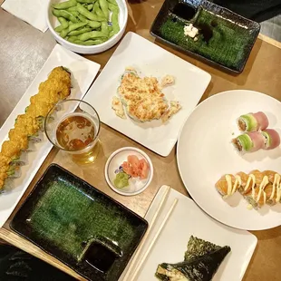 a variety of sushi dishes on a table