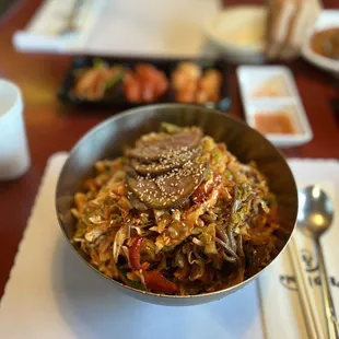 a bowl of asian food