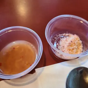 two bowls of soup and a spoon