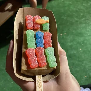 A coffee popsicle with sour patch kids