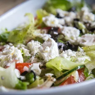 Greek Salad: Ripe Tomato, creamy feta, parsley, lemon, and crisp cucumber. Gluten Free. Vegan upon request.