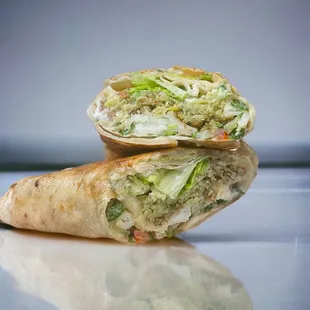 House Falafel Wrap: Stuffed with deeply seasoned fried falafel, crunchy organic lettuce, ripe tomato. Vegan.