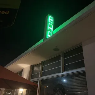 neon sign on building at night