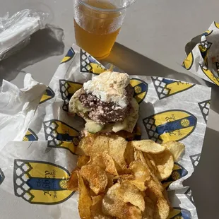 The way to my heart is a delicious burger, chips, and sour beer.