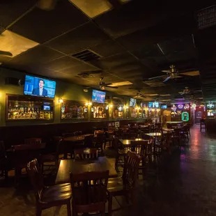 the bar and televisions in the background