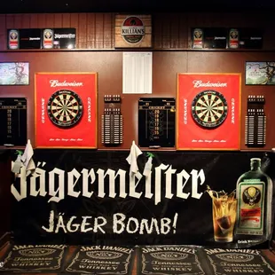 a dart and darts on the wall