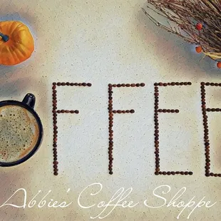 a cup of coffee and a pumpkin