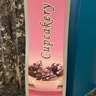 a sign for a cupcake shop
