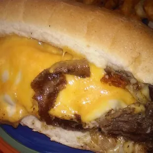 Our famous philly steak with grilled onions and mushrooms and green pepper. Smothered in melted cheddar and Swiss cheese.